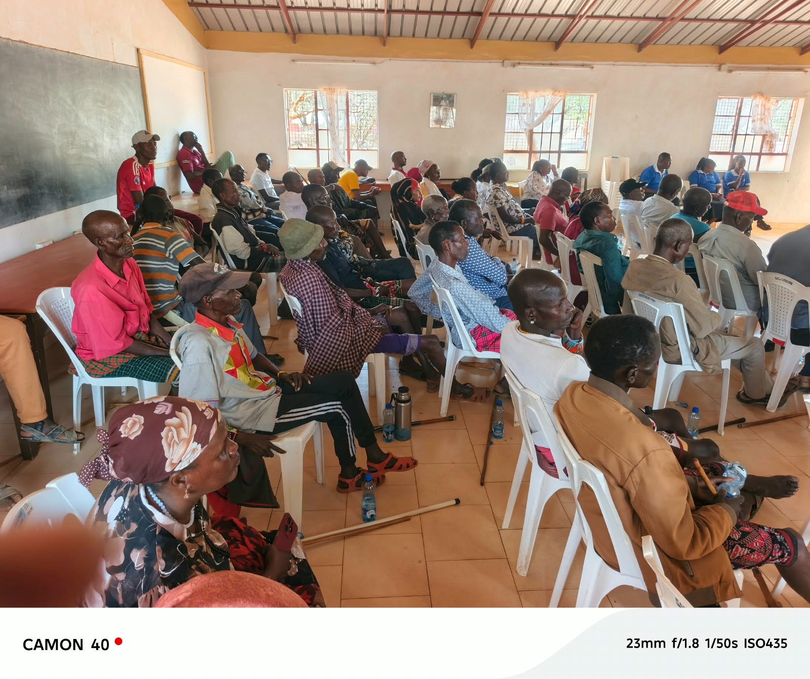 Community members giving feedback in Wamba